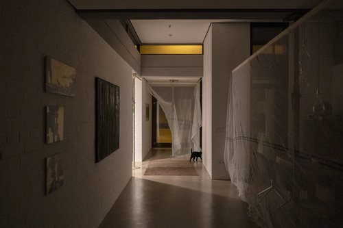 The living area in a vila was divided into two areas with a temporary curtain - at night.