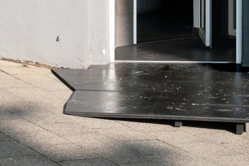 Access to a building. A small ramp connects the different levels.